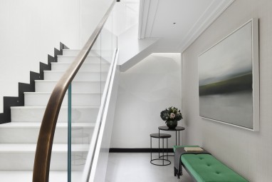 The Brummell Penthouse: Polished white Namibia marble staircase with bespoke sculptural plaster wall in a geometric relief pattern